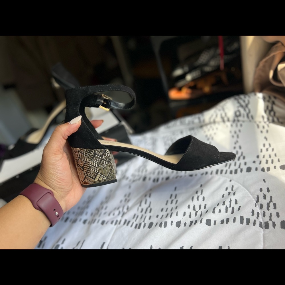 Nine West, open toe, block heel with gold accents. Size 8.5. Lightly worn.